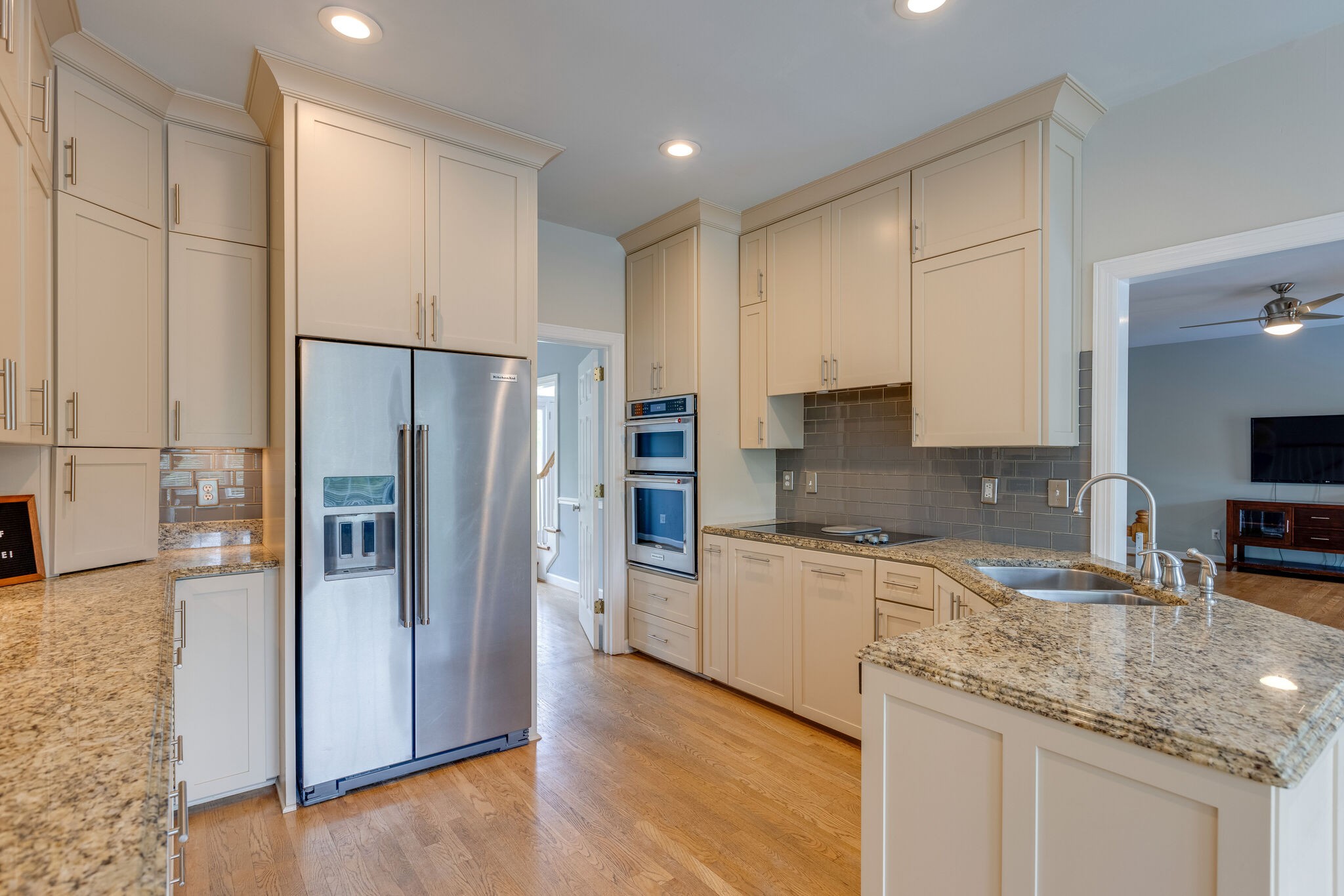 211 Hillside Drive Franklin, TN 37067 - Photo 13 of 43 a kitchen with granite countertop a refrigerator and a sink
