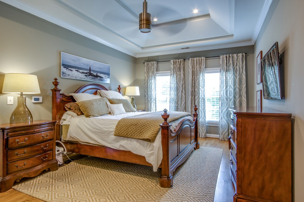 211 Hillside Drive Franklin, TN 37067 - Photo 15 of 43 a bedroom with a bed lamp and a window