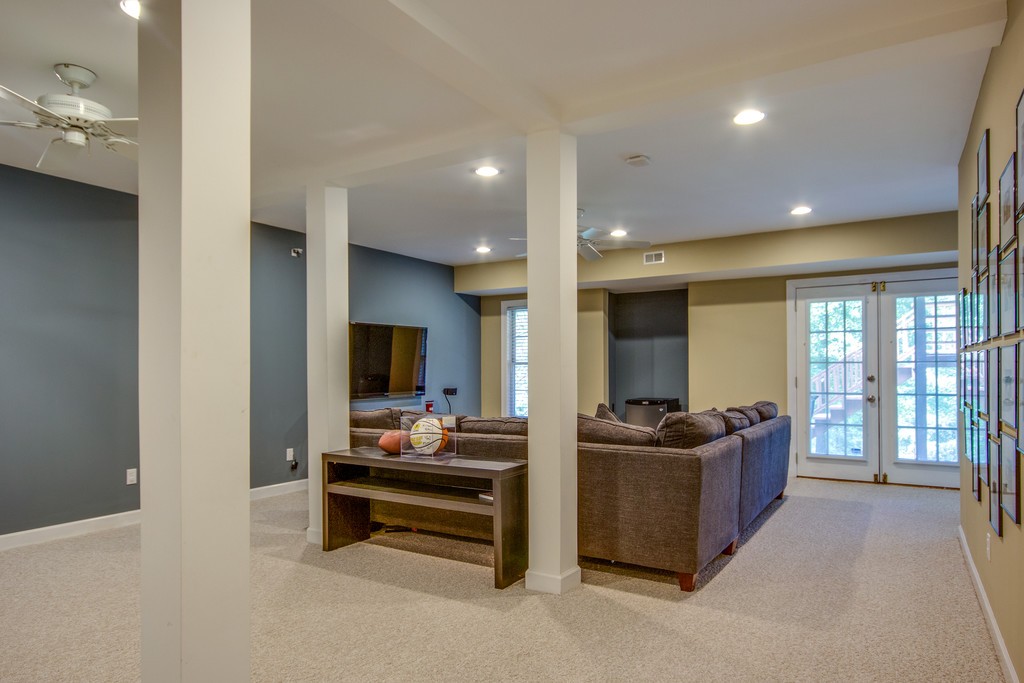 211 Hillside Drive Franklin, TN 37067 - Photo 24 of 43 a living room with furniture and a flat screen tv
