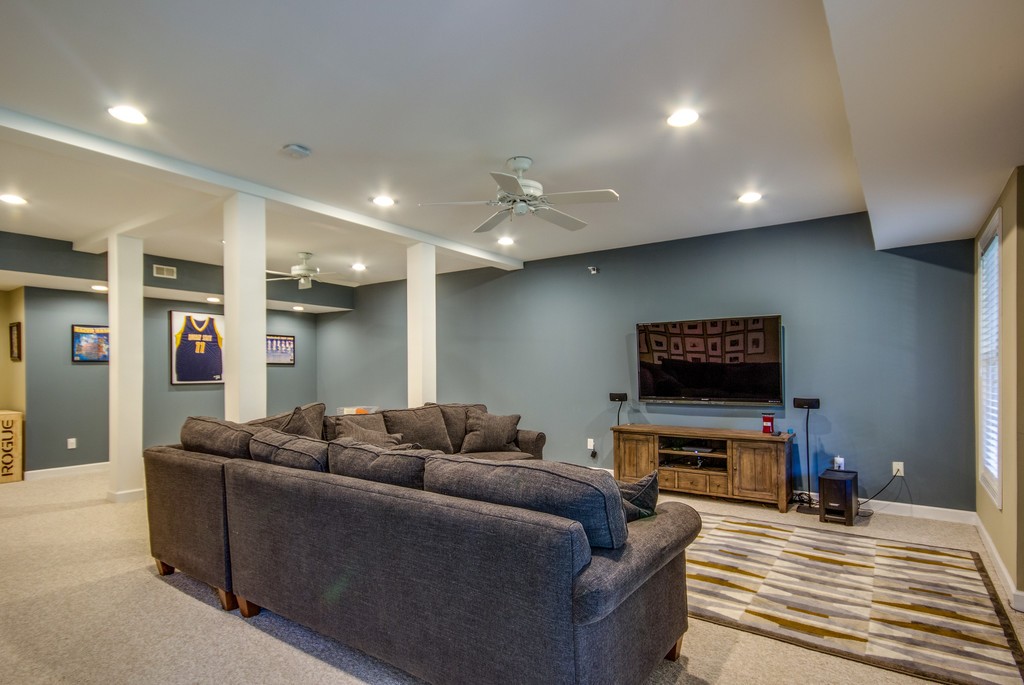 211 Hillside Drive Franklin, TN 37067 - Photo 25 of 43 a living room with furniture and a flat screen tv
