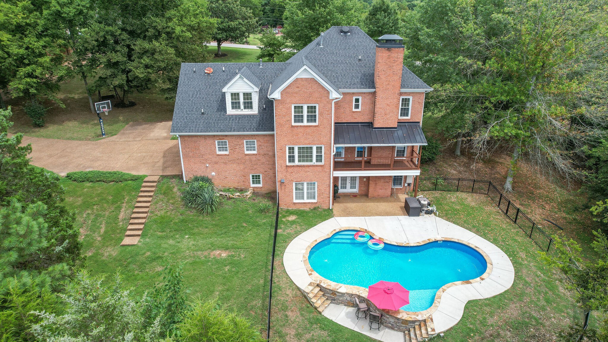 211 Hillside Drive Franklin, TN 37067 - Photo 43 of 43 a front view of a house with a yard and trees