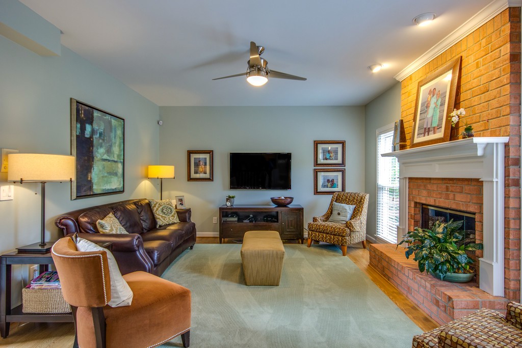 211 Hillside Drive Franklin, TN 37067 - Photo 8 of 43 a living room with furniture and a fireplace