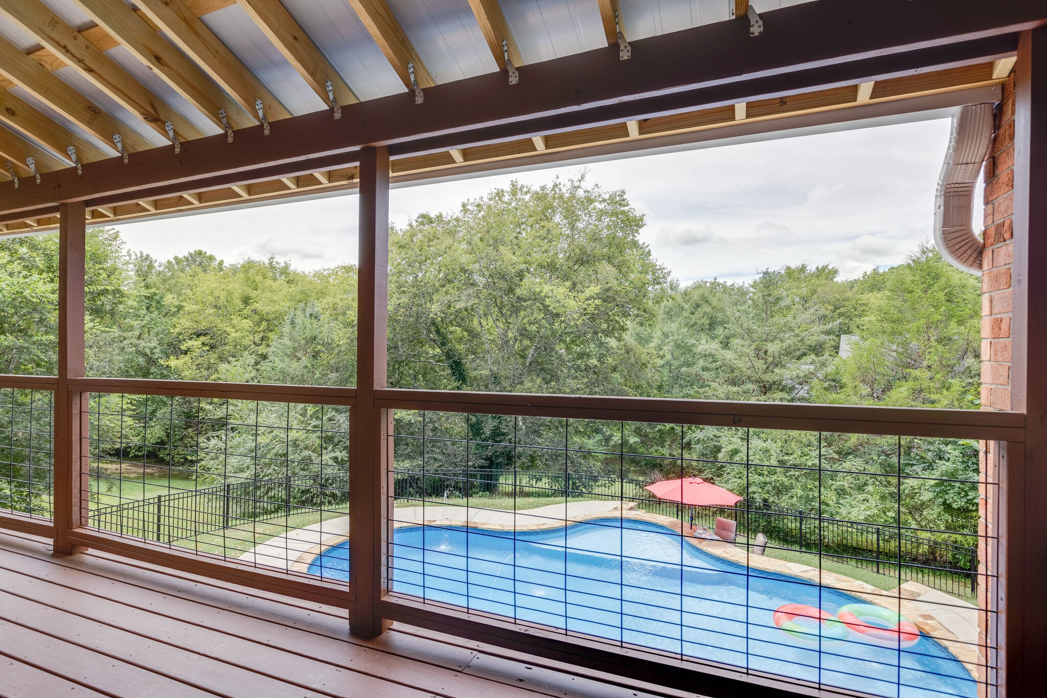 211 Hillside Drive Franklin, TN 37067 - Photo 9 of 43 a view of a balcony with wooden floor