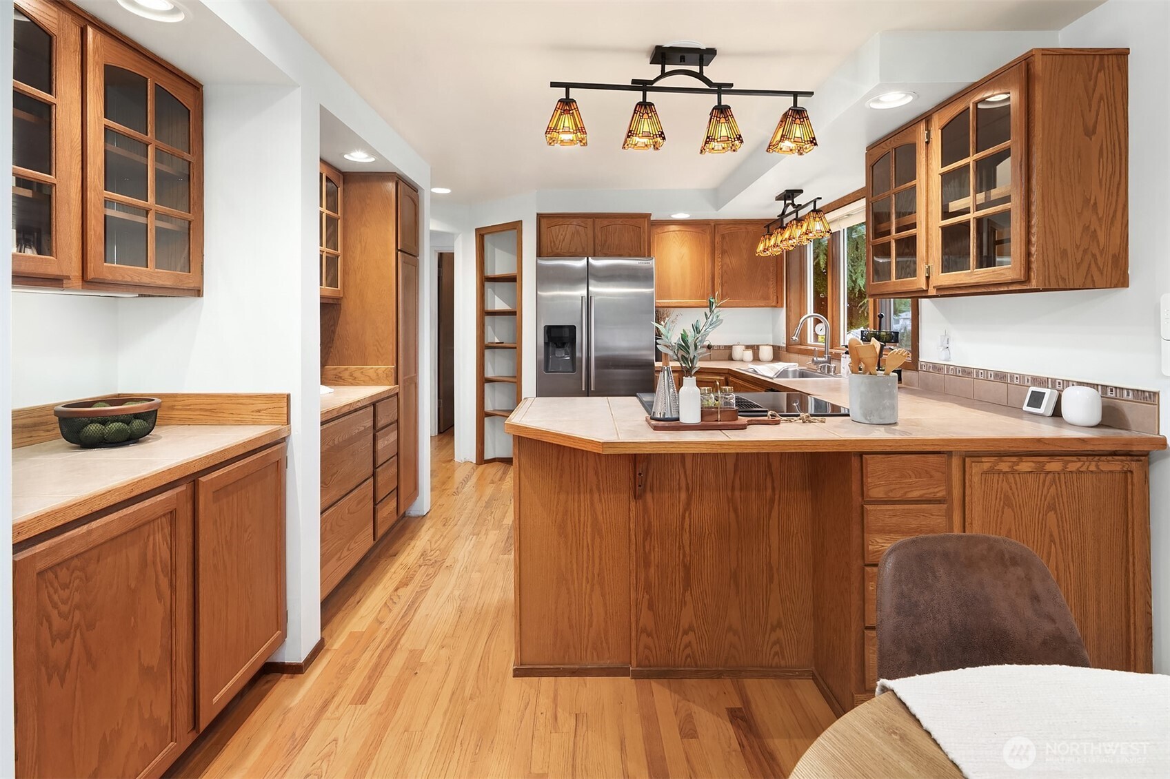 637 Elm Place Edmonds, WA 98020 - Photo 13 of 34 a kitchen with stainless steel appliances sink refrigerator and stove