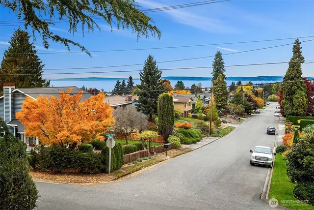a bedroom with a bed a couch and a window