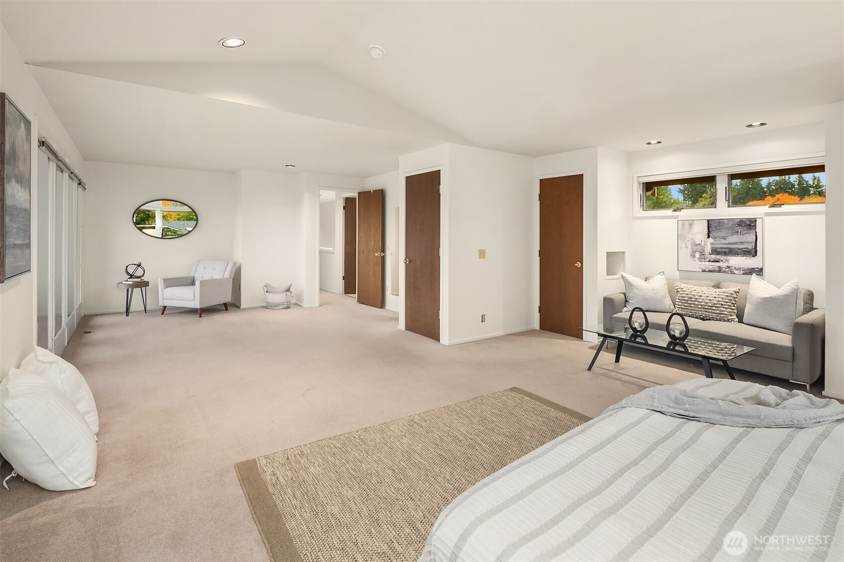 637 Elm Place Edmonds, WA 98020 - Photo 23 of 34 a bedroom with a bed a couch and a window