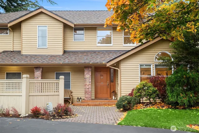 a front view of a house with a garden