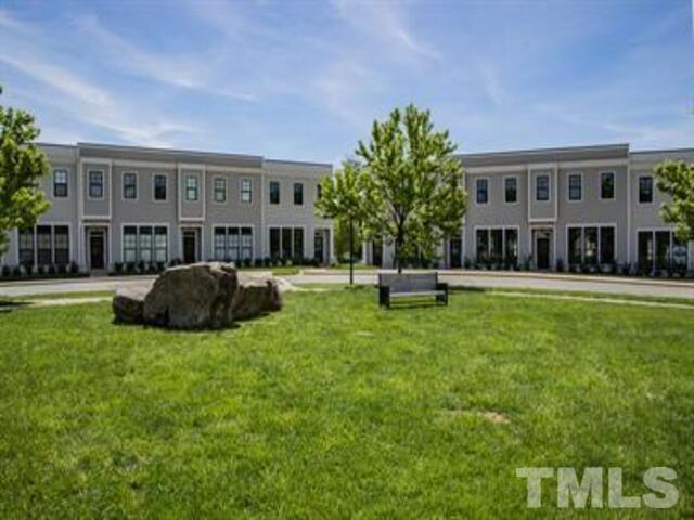 102 Philip's Square Chapel Hill, NC 27516 - Photo 1 of 25 a house view with swimming pool and chairs