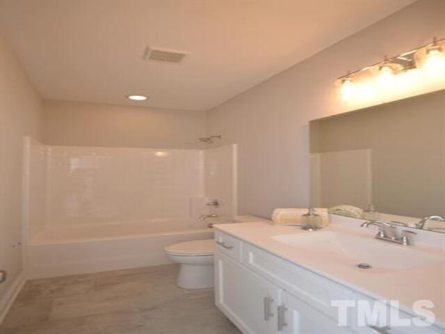 102 Philip's Square Chapel Hill, NC 27516 - Photo 17 of 25 a bathroom with a bathtub shower sink vanity and toilet