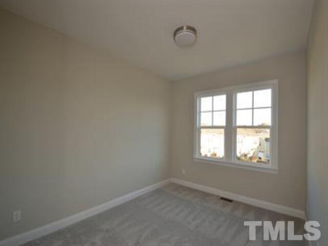 102 Philip's Square Chapel Hill, NC 27516 - Photo 18 of 25 an empty room with a window
