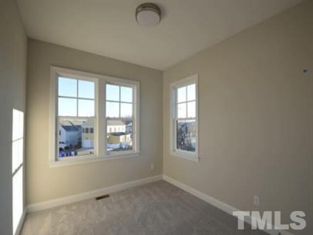 102 Philip's Square Chapel Hill, NC 27516 - Photo 19 of 25 an empty room with windows