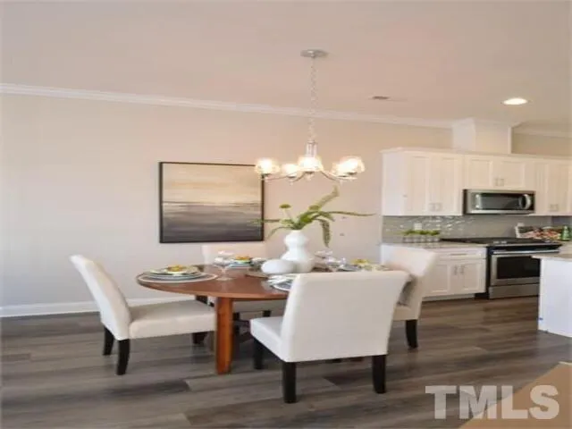 a kitchen with wooden cabinets and a stove top oven