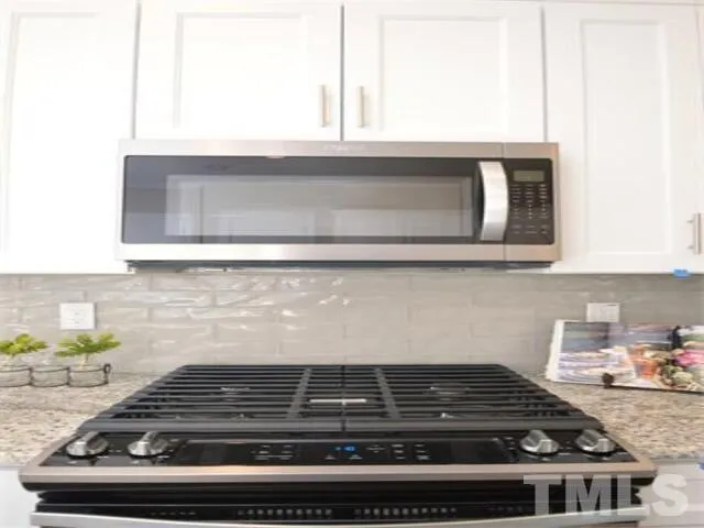 a kitchen with sink and a window