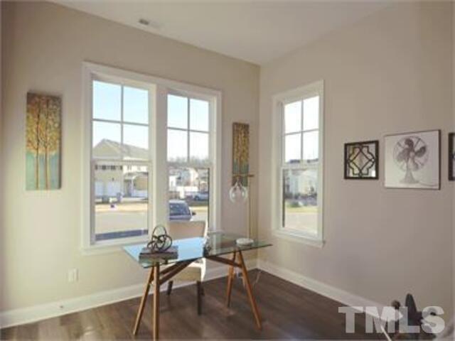 102 Philip's Square Chapel Hill, NC 27516 - Photo 8 of 25 a room with lounge chair and windows