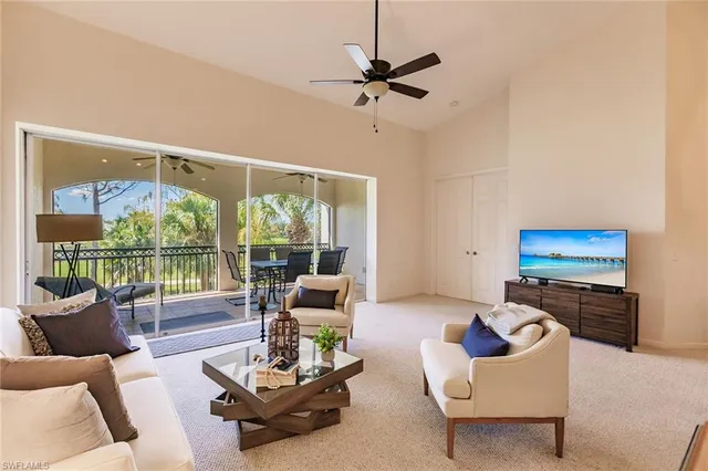 a room with a table chairs and a lamp