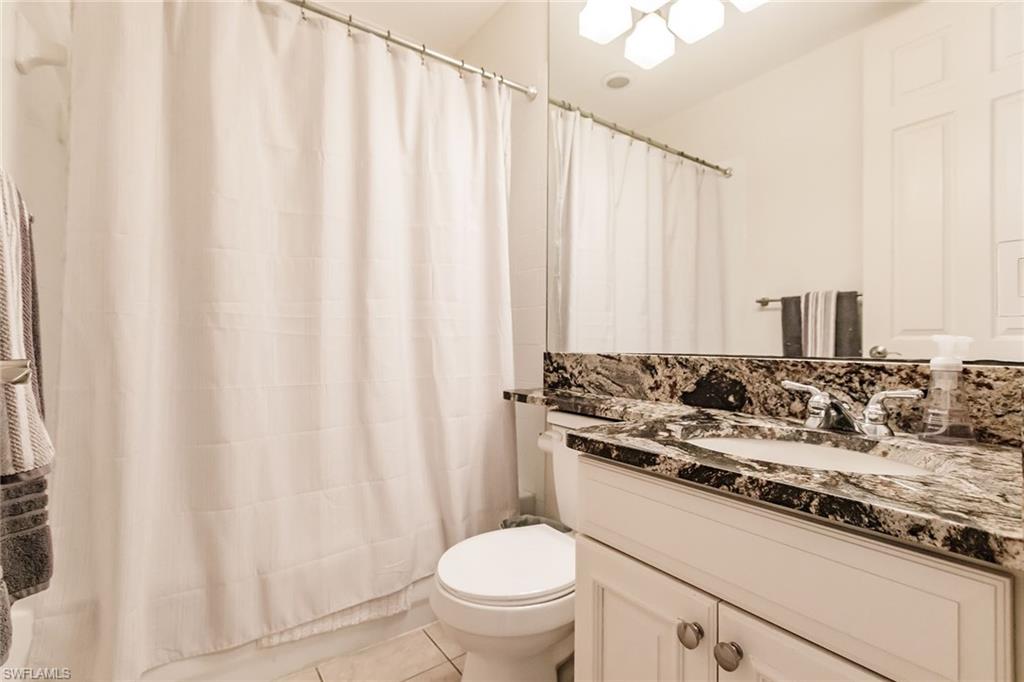 3940 Deer Crossing Court, Unit 4203 Naples, FL 34114 - Photo 38 of 46 a bathroom with a sink and a toilet