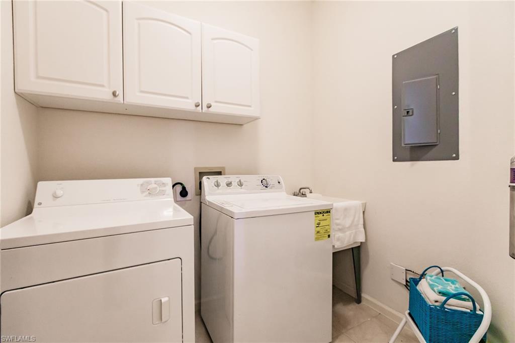 3940 Deer Crossing Court, Unit 4203 Naples, FL 34114 - Photo 39 of 46 a utility room with dryer and washer