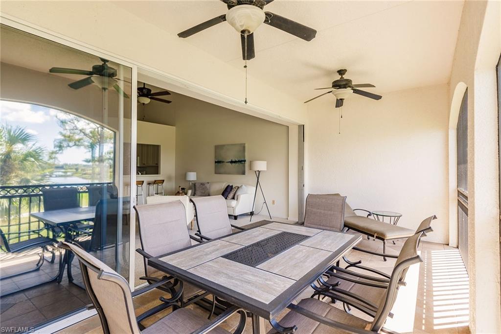 3940 Deer Crossing Court, Unit 4203 Naples, FL 34114 - Photo 45 of 46 a view of a dining room with furniture window and outside view