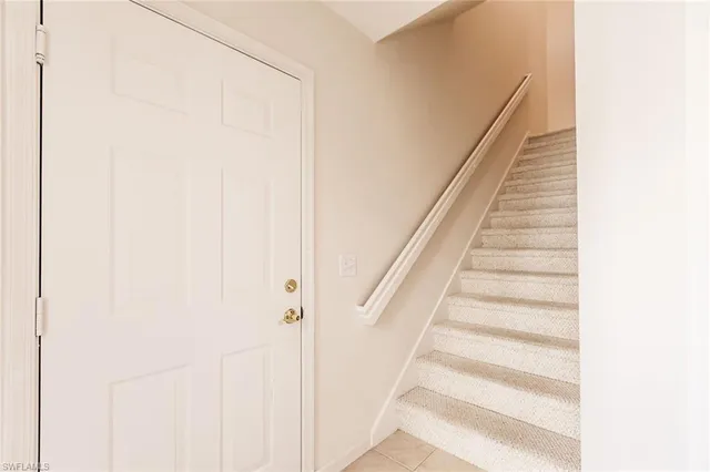 a view of livingroom with furniture and front door