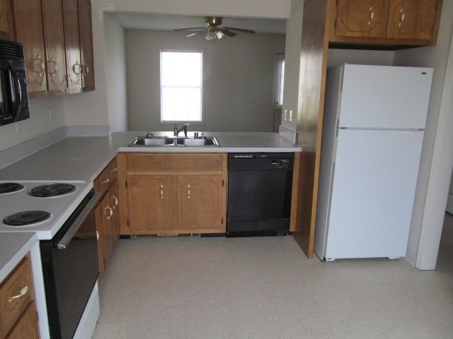 217 Tree Line Drive Oak Grove, KY 42262 - Photo 2 of 13 a room with a refrigerator and a stove