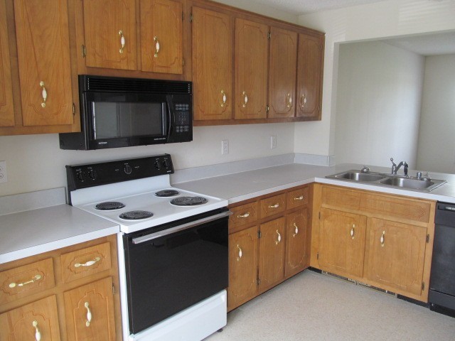 217 Tree Line Drive Oak Grove, KY 42262 - Photo 3 of 13 a kitchen with stainless steel appliances a stove a microwave and sink