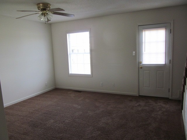 217 Tree Line Drive Oak Grove, KY 42262 - Photo 5 of 13 an empty room with a window and a fan
