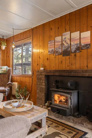 a view of house with backyard outdoor seating and trees