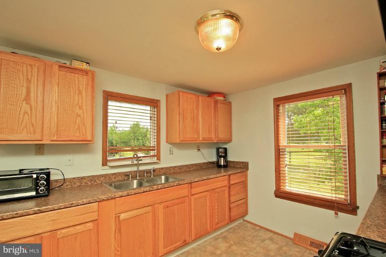 19628 Anderson Mill Road Beaverdam, VA 23015 - Photo 12 of 29 a kitchen with granite countertop a sink cabinets and window