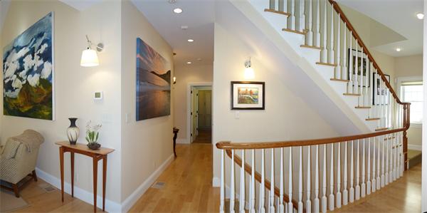 20 Bridge Road, Unit 29 Northampton, MA 01062 - Photo 15 of 30 a view of a hallway with wooden floor and stairs