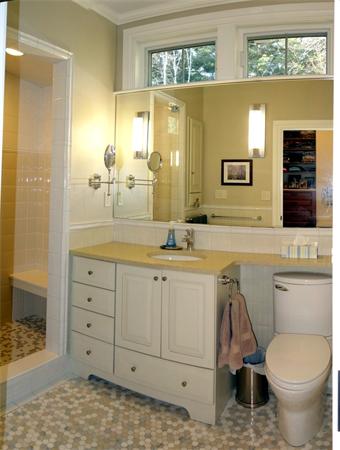 20 Bridge Road, Unit 29 Northampton, MA 01062 - Photo 18 of 30 a bathroom with a granite countertop toilet sink and mirror