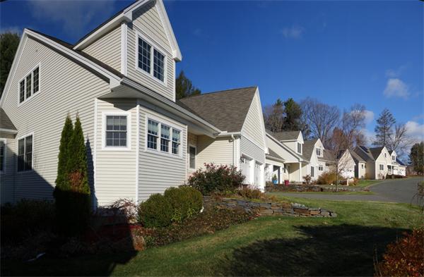 20 Bridge Road, Unit 29 Northampton, MA 01062 - Photo 2 of 30 a front view of a house with a yard