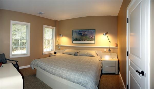 20 Bridge Road, Unit 29 Northampton, MA 01062 - Photo 30 of 30 a bedroom with a bed and a couch next to a window
