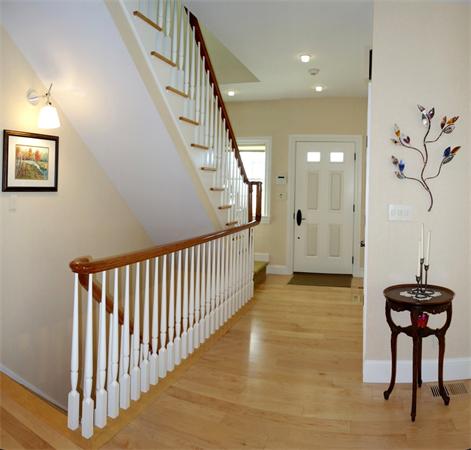 20 Bridge Road, Unit 29 Northampton, MA 01062 - Photo 4 of 30 a view of a hallway with wooden floor and stairs