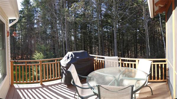 20 Bridge Road, Unit 29 Northampton, MA 01062 - Photo 8 of 30 a view of a chairs and table on the deck