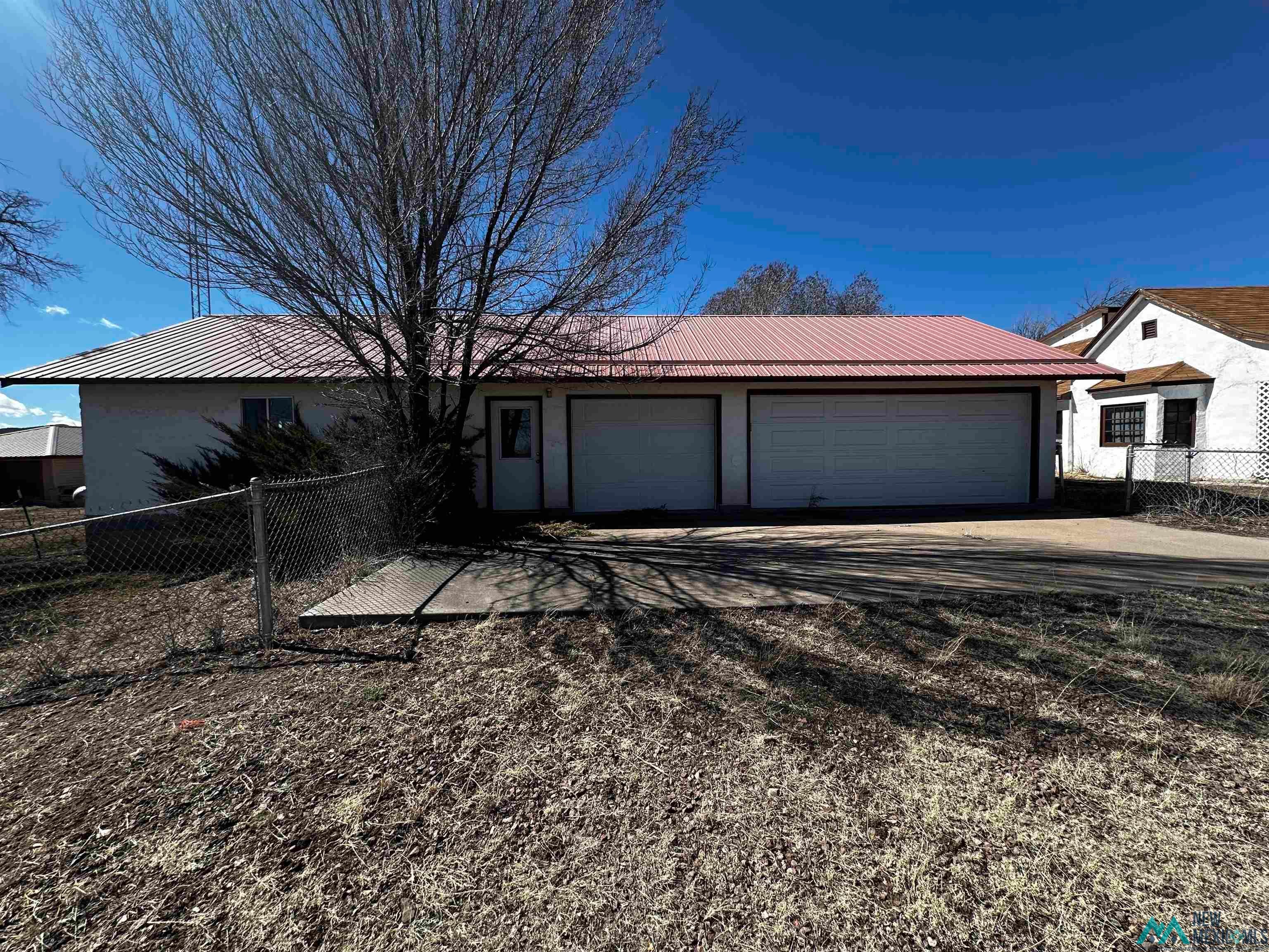 31 Bill Knight Gap Road Luna, NM 87824 - Photo 31 of 41 Ranch-style home featuring a metal roof and stucco siding