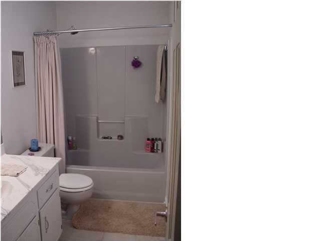 82 East Wild Briar Road Santa Rosa Beach, FL 32459 - Photo 12 of 26 a bathroom with a granite countertop bathtub shower sink vanity and toilet