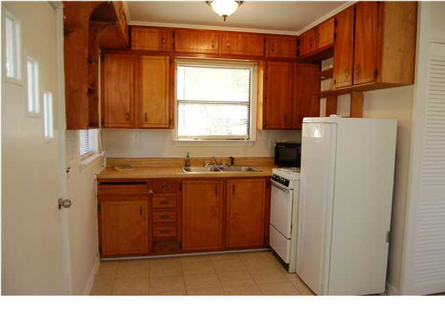 82 East Wild Briar Road Santa Rosa Beach, FL 32459 - Photo 18 of 26 a kitchen with a sink window and cabinets