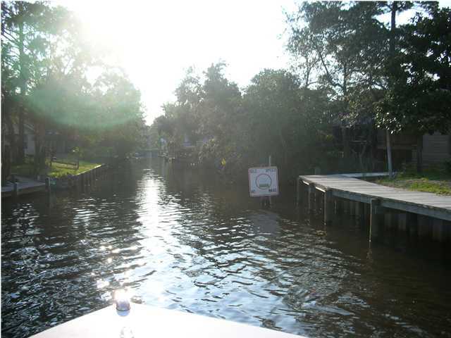 82 East Wild Briar Road Santa Rosa Beach, FL 32459 - Photo 25 of 26 a backyard of a house with lots of green space and fountain