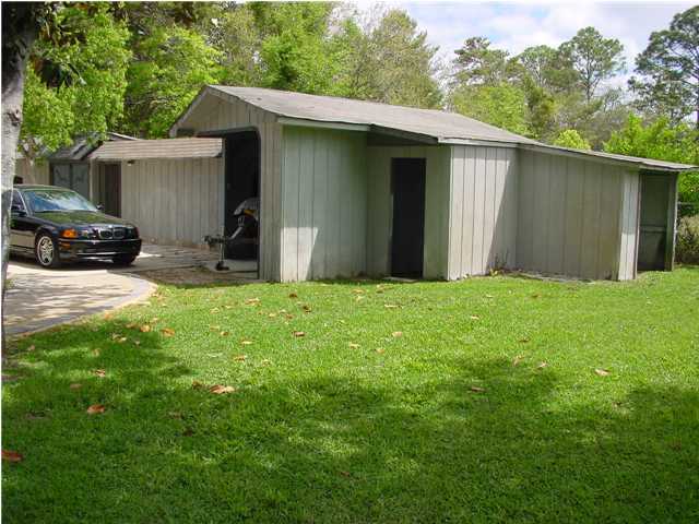 82 East Wild Briar Road Santa Rosa Beach, FL 32459 - Photo 26 of 26 a view of a house with yard and a car