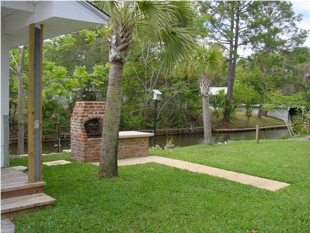 82 East Wild Briar Road Santa Rosa Beach, FL 32459 - Photo 4 of 26 a view of a house with a yard and tree s