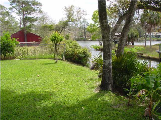 82 East Wild Briar Road Santa Rosa Beach, FL 32459 - Photo 5 of 26 a view of a garden with a tree