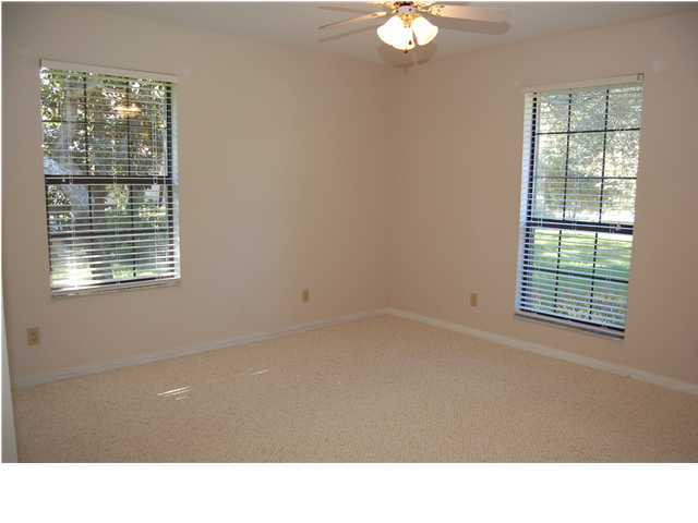 82 East Wild Briar Road Santa Rosa Beach, FL 32459 - Photo 7 of 26 a room with a window and a ceiling fan