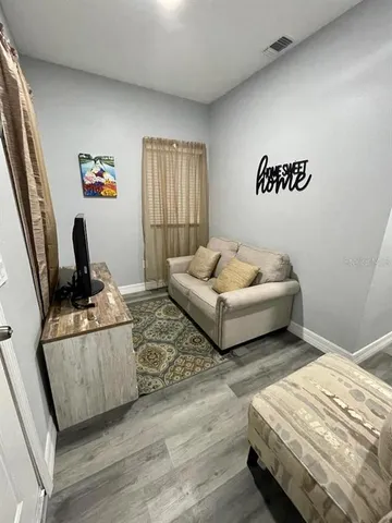 a living room with furniture and a couch