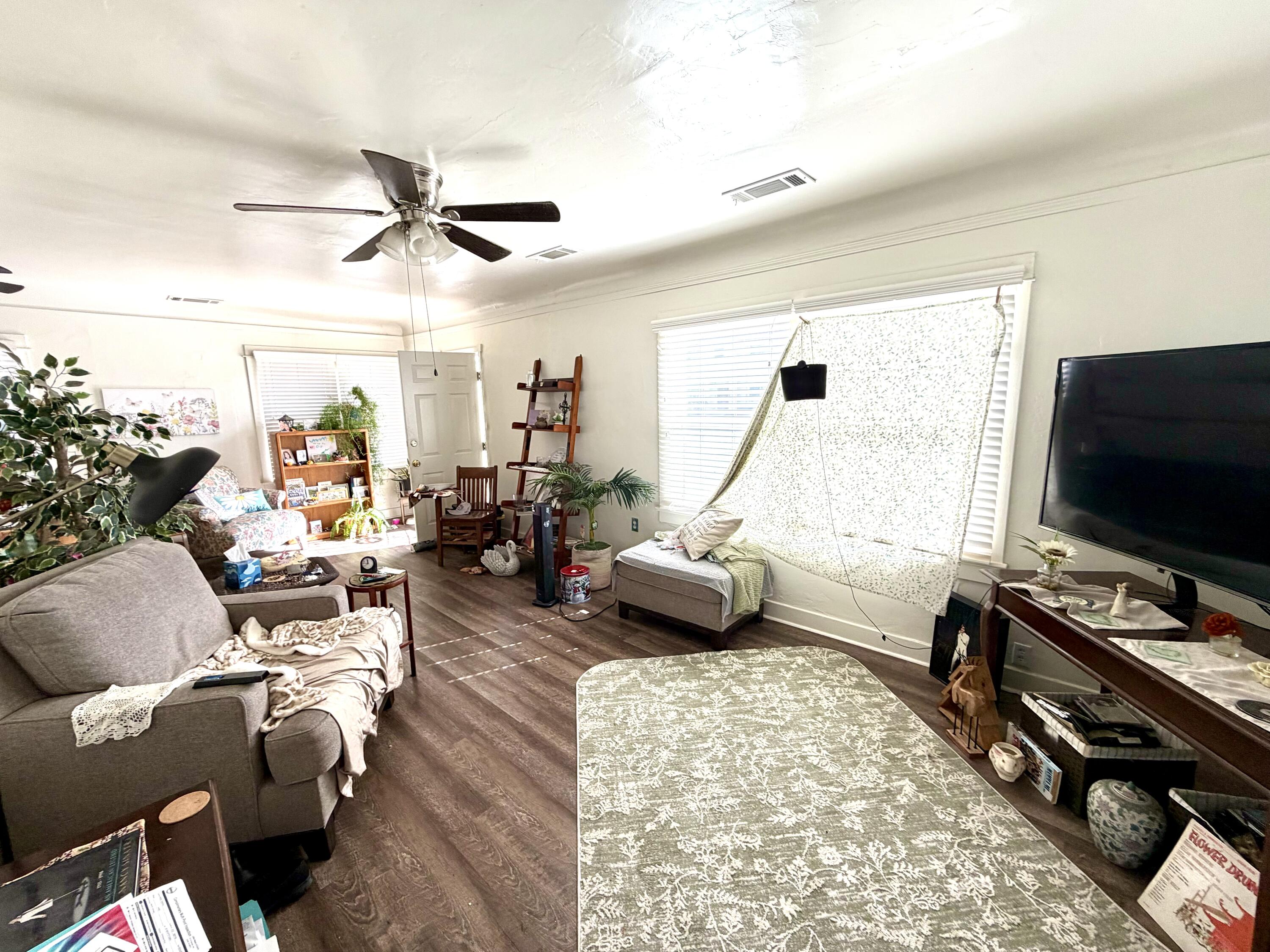 200 North B Street Exeter, CA 93221 - Photo 18 of 20 a living room with furniture and a flat screen tv