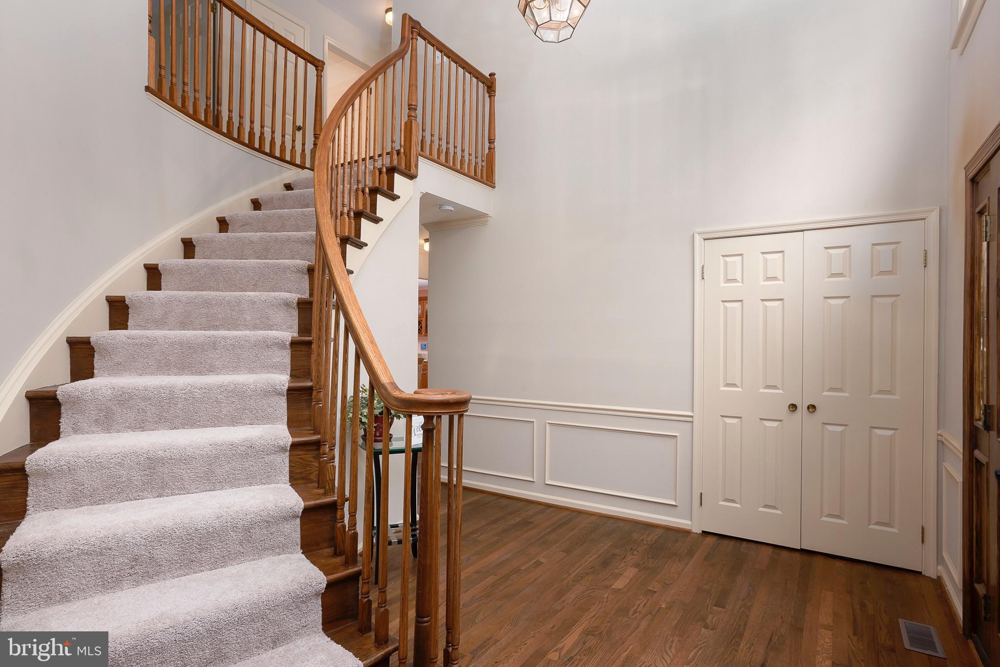 5208 Durham Road East Columbia, MD 21044 - Photo 3 of 36 a view of entryway with wooden floor and stairs