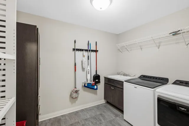 a view of storage and utility room with washer and dryer