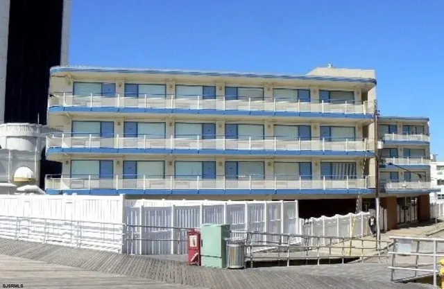 a front view of a building with glass windows