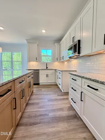 a large kitchen with cabinets