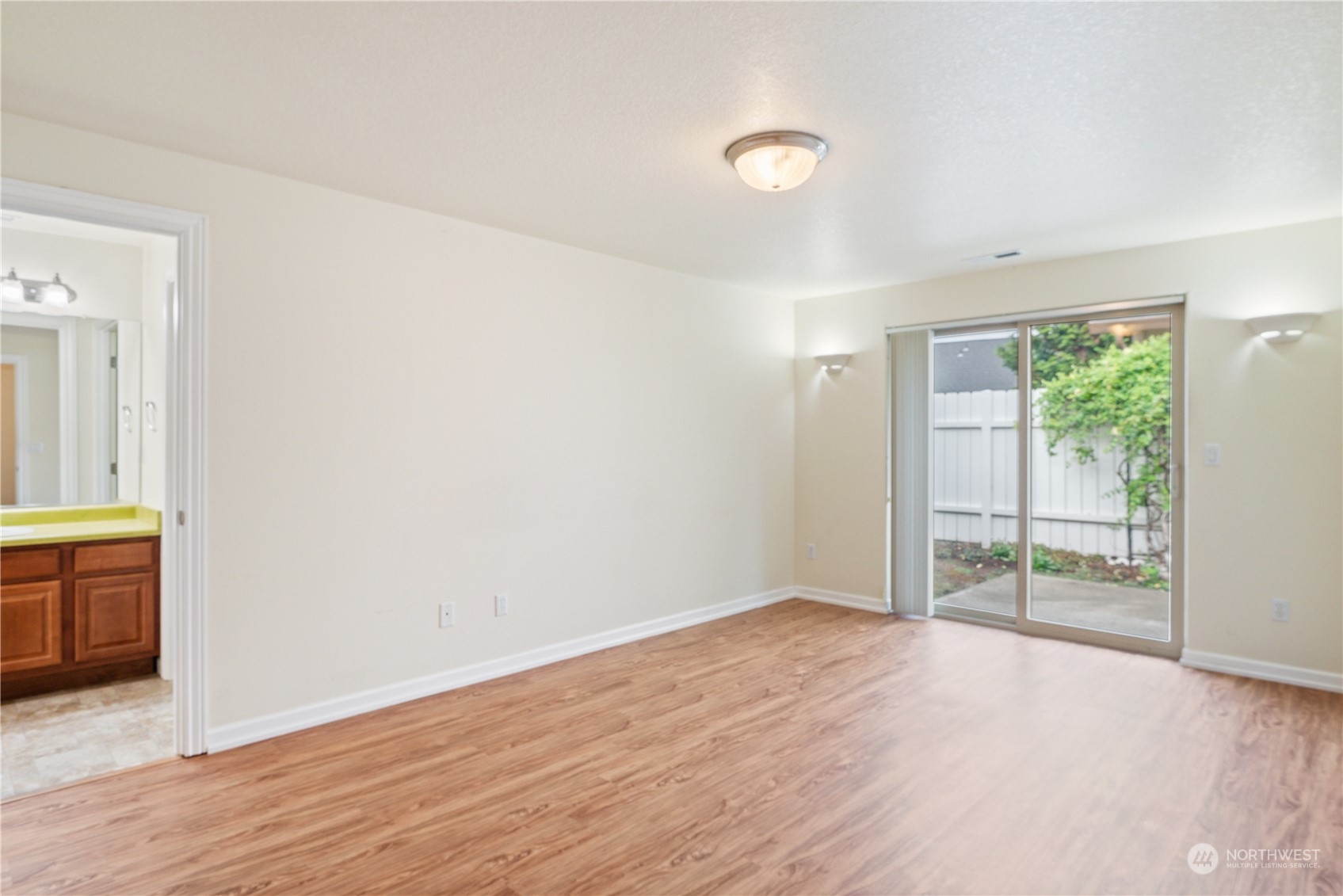 8 Willow Pointe Loop Longview, WA 98632 - Photo 11 of 29 an empty room with wooden floor and windows