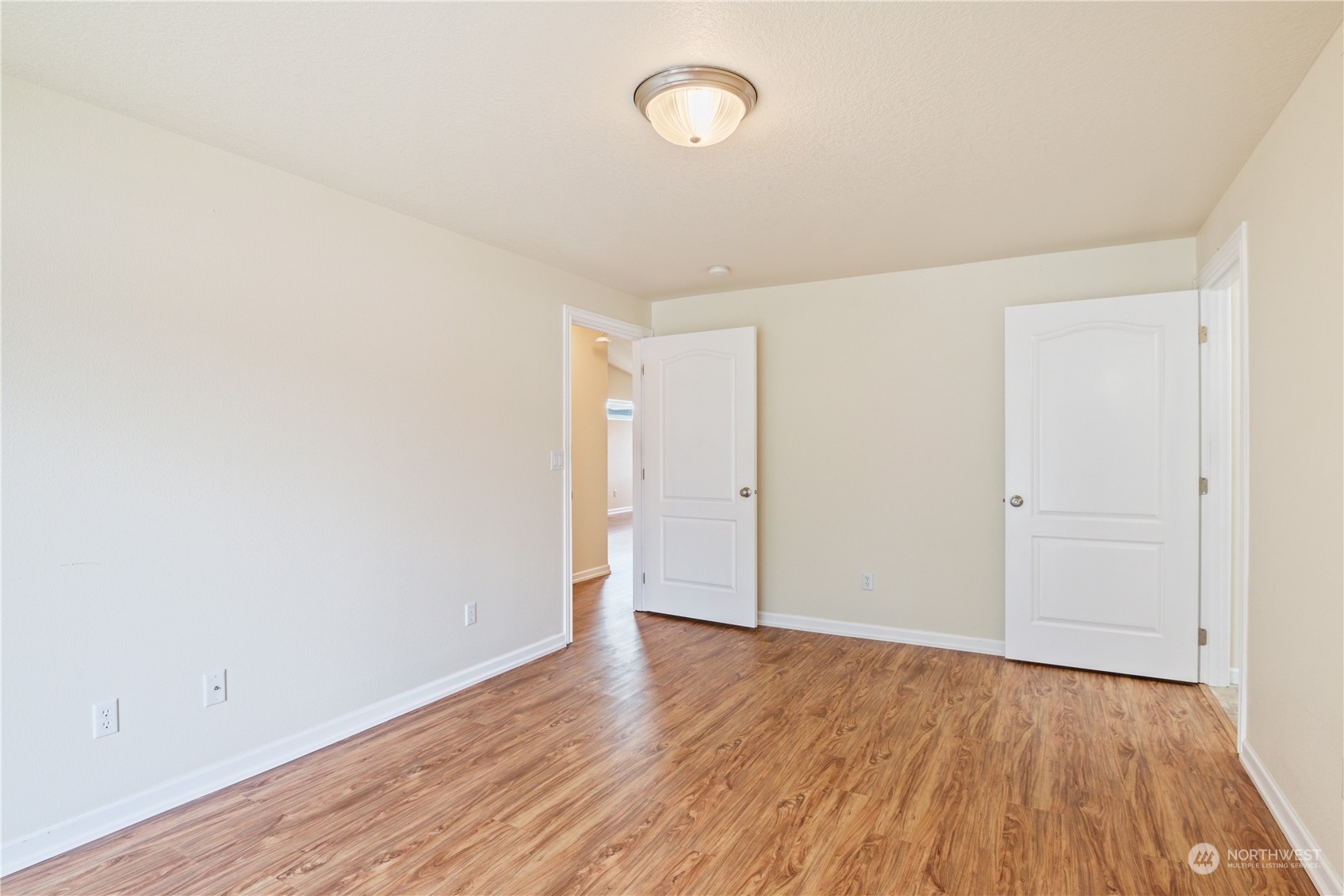 8 Willow Pointe Loop Longview, WA 98632 - Photo 12 of 29 an empty room with wooden floor and windows